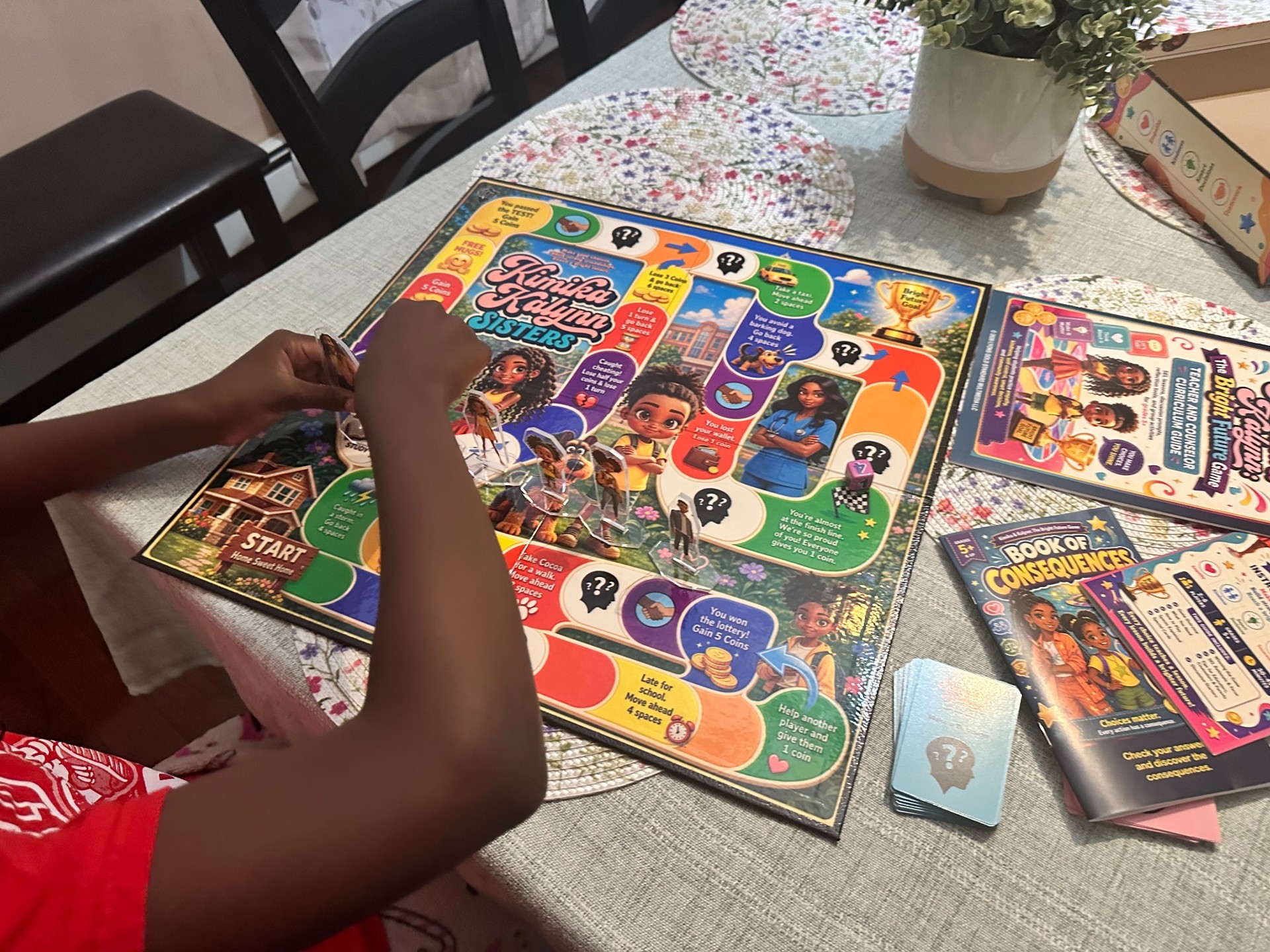 A child plays the Bright Future Game with the board and character pieces